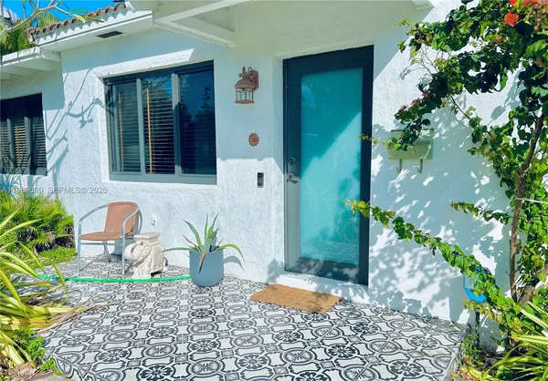 a potted plant in front of a house