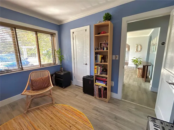 a living room with furniture and a window