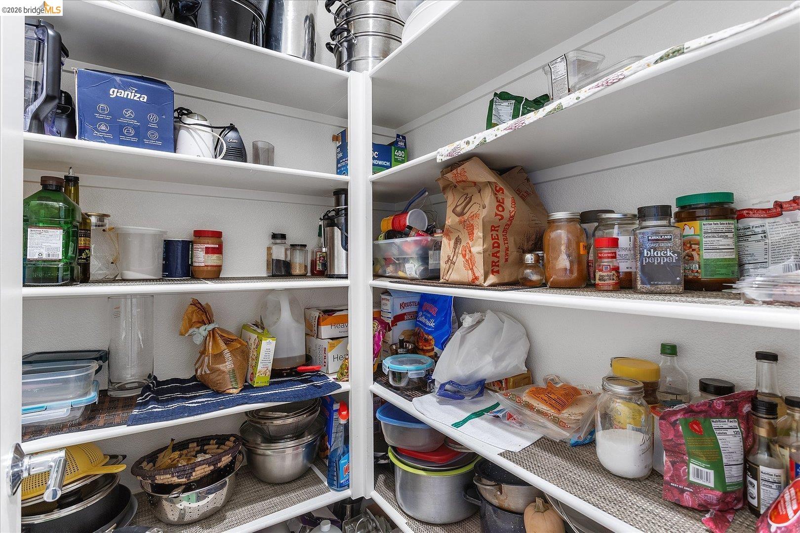 5601 Ridgepoint Way Antioch, CA 94531 - Photo 20 of 59 Floor-to-ceiling pantry shelving with white finishes and ample storage capacity