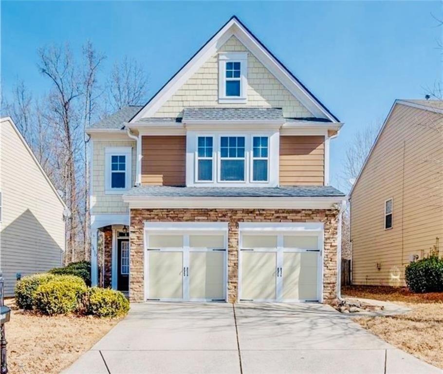 5430 Crestwick Way Cumming, GA 30040 - Photo 2 of 23 a front view of a house with garden