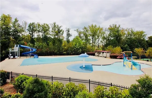 a view of a swimming pool with a patio