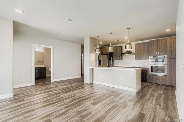 a view of kitchen with wooden floor