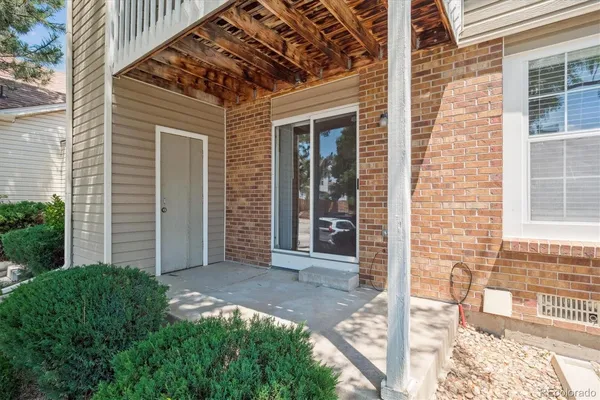 a view of a brick house with a large window