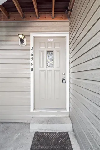 a view of a door and a window