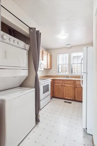 a kitchen with a stove a sink and a refrigerator