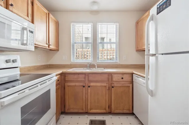 a view of a kitchen with a sink cabinets and a window