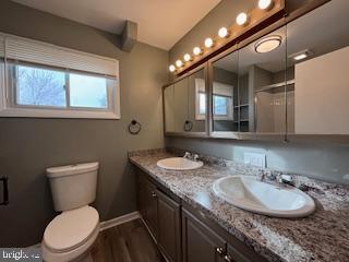 221 Hempt Road Mechanicsburg, PA 17050 - Photo 13 of 29 a bathroom with a granite countertop toilet sink and mirror