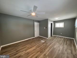 221 Hempt Road Mechanicsburg, PA 17050 - Photo 9 of 29 a view of an empty room with wooden floor and a window