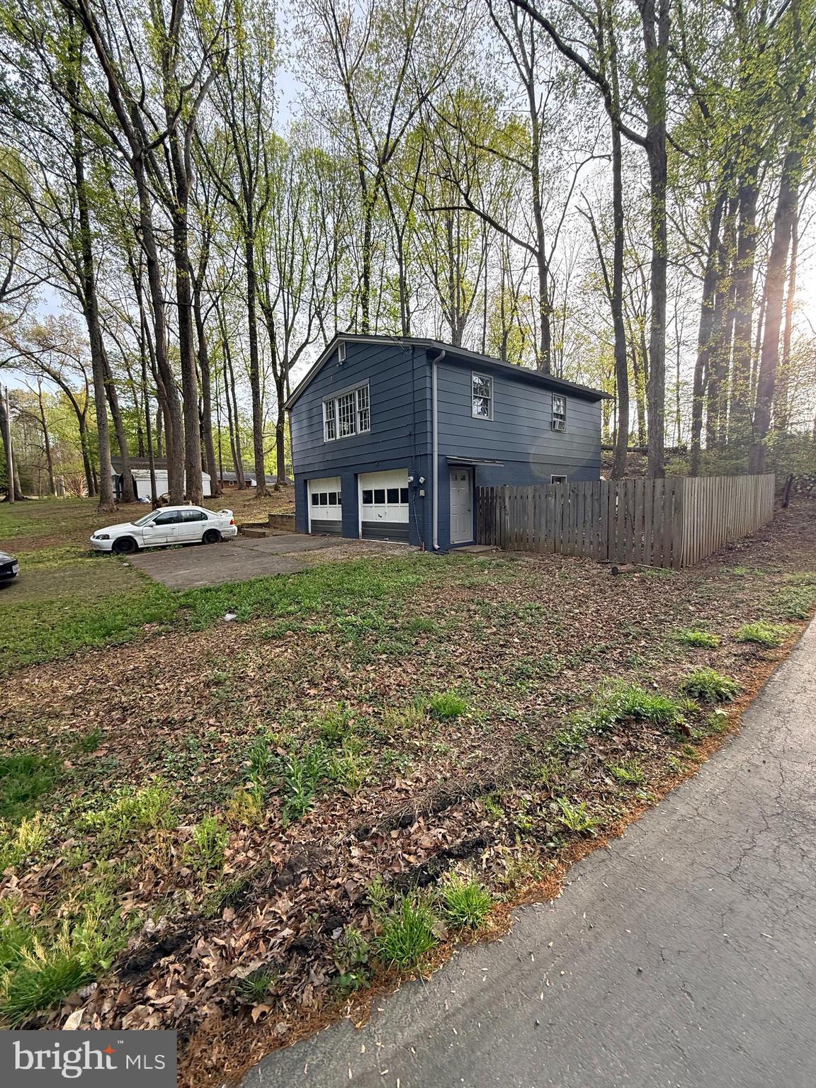 6910 Token Valley Road Manassas, VA 20112 - Photo 3 of 8 a view of a house with a yard and trees
