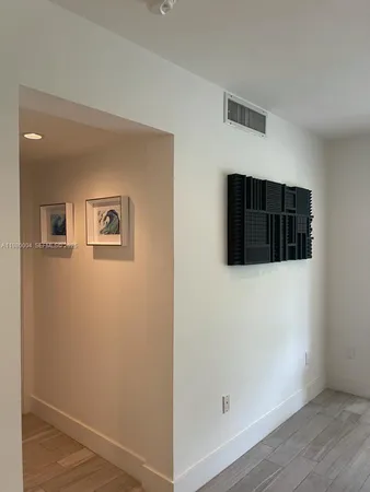a view of a livingroom with wooden floor