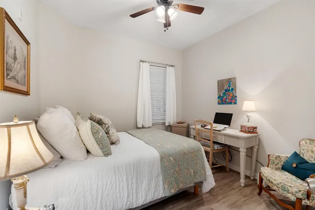 a bedroom with a bed and a workspace