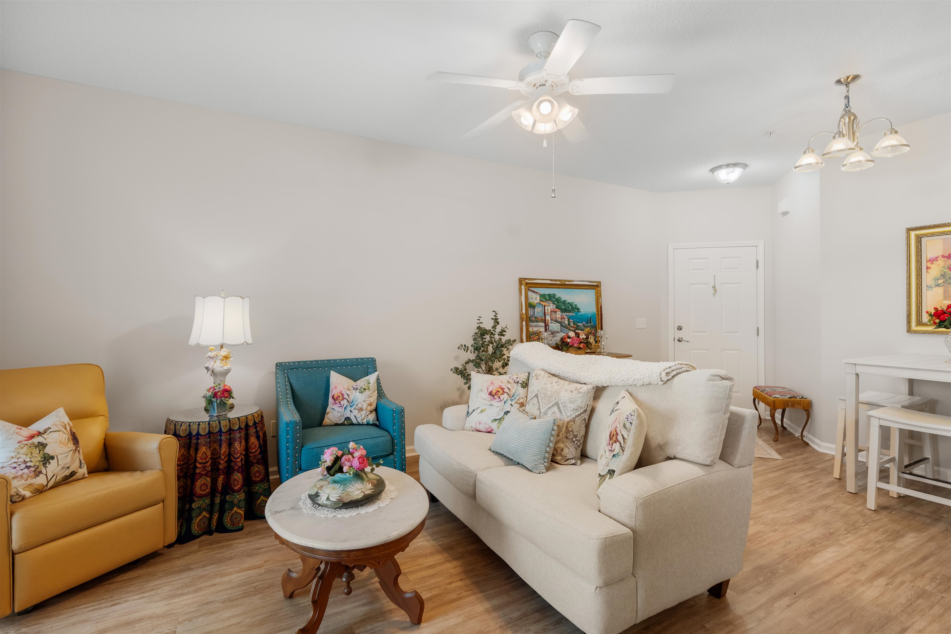 2251 Golden Lake Loop St. Augustine, FL 32084 - Photo 5 of 31 a living room with furniture a table and a fireplace