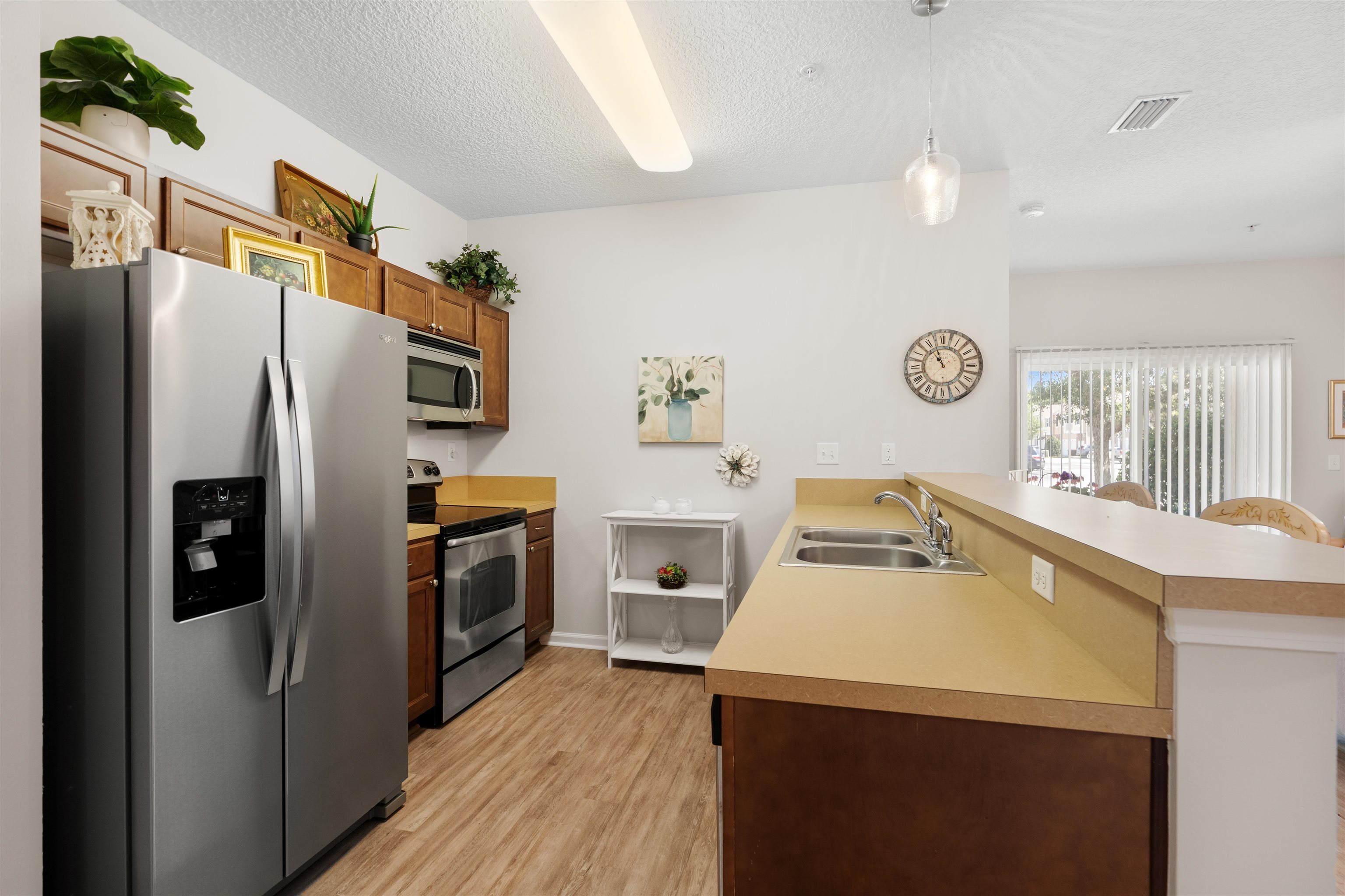 2251 Golden Lake Loop St. Augustine, FL 32084 - Photo 8 of 31 a kitchen with a refrigerator sink and wooden floor