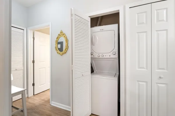 a close view of a utility room with dryer and washer