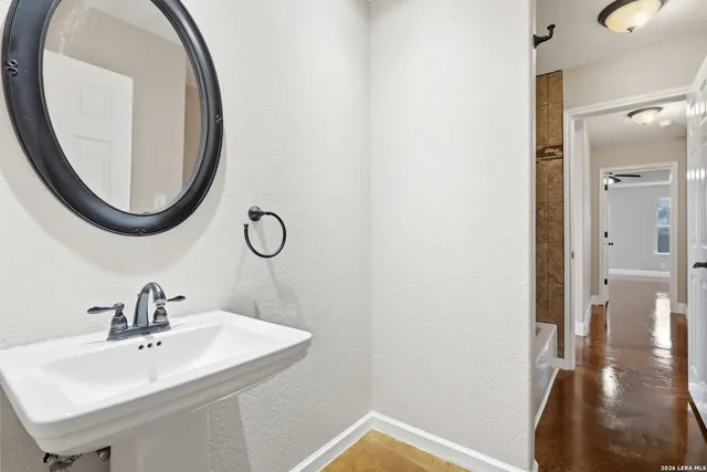 a bathroom with a sink and a mirror