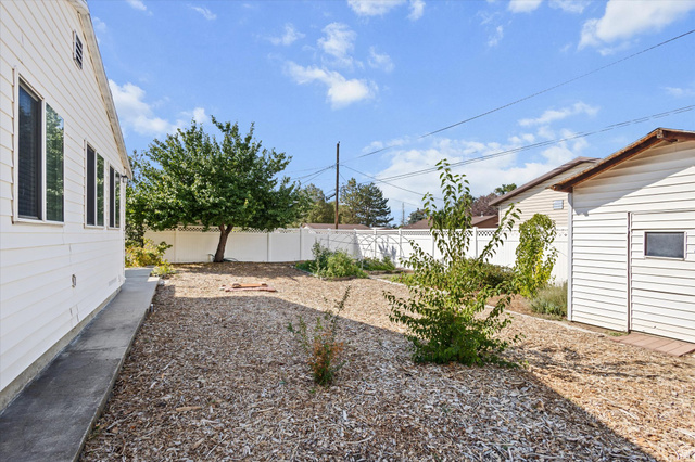 215 Carol Way Midvale, UT 84047 - Photo 28 of 30 View of fenced backyard