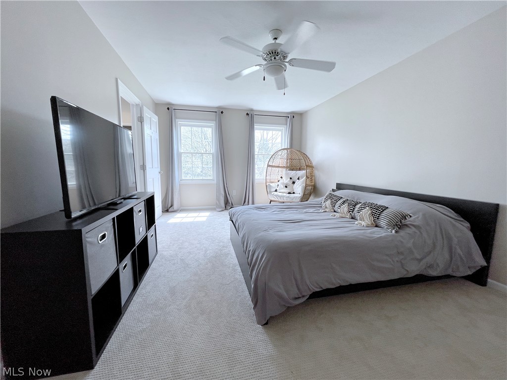 718 Sunridge Road Fairlawn, OH 44333 - Photo 28 of 49 Bedroom featuring light colored carpet and ceiling fan