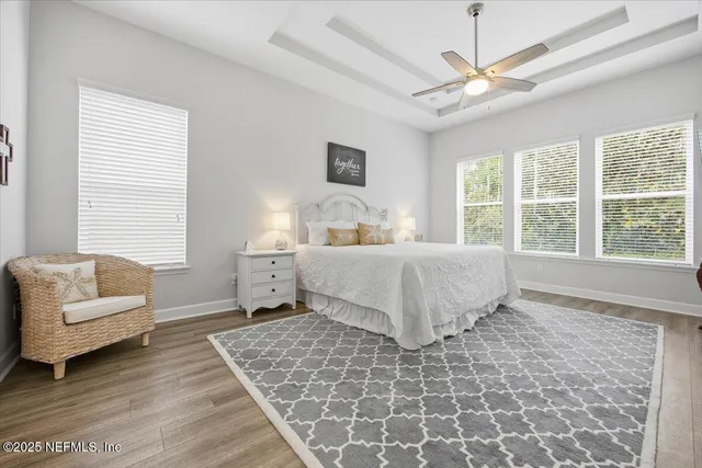 a bedroom with a large bed and a couch