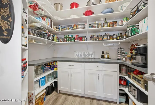 a kitchen with cabinets and white appliances