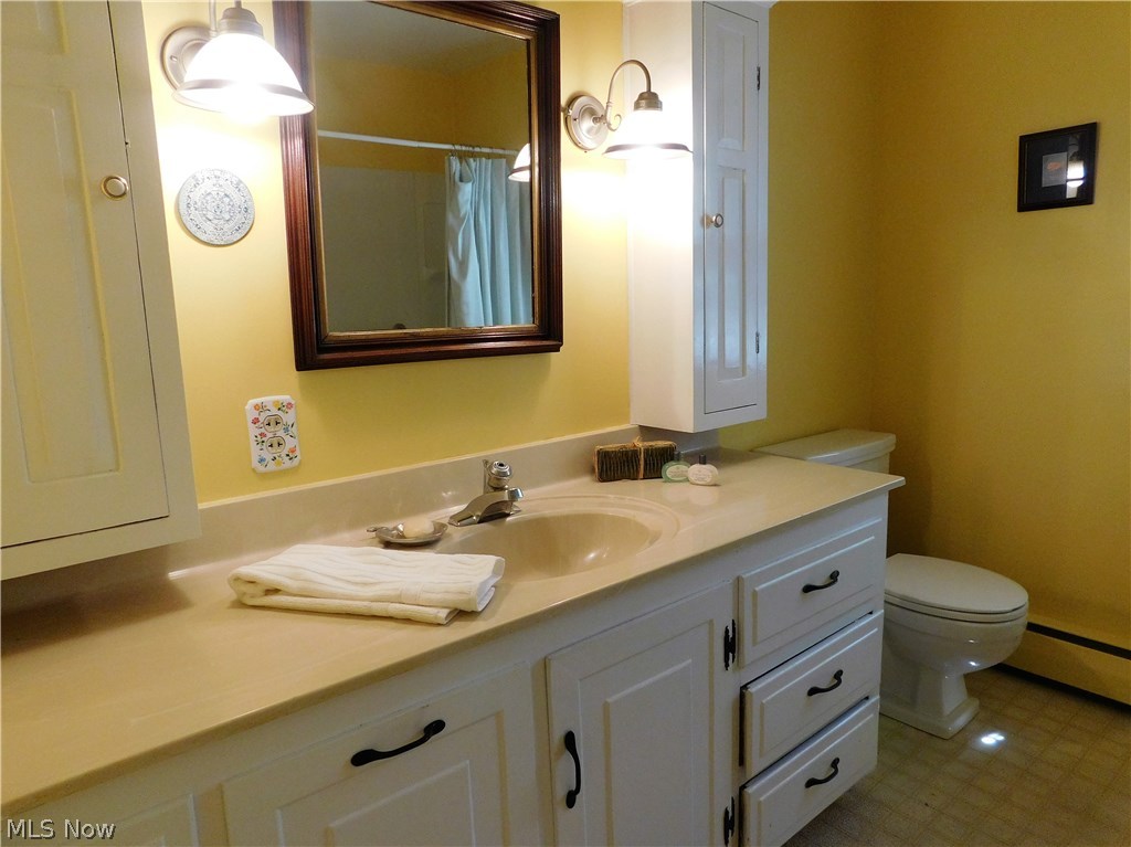 6939 Case Road North Ridgeville, OH 44039 - Photo 23 of 35 First floor bath has large vanity with double medicine cabinets & corian counter top