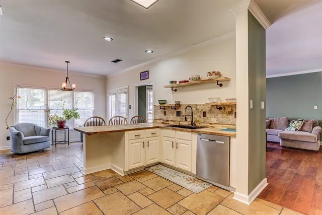a living room with furniture a fireplace and a city view