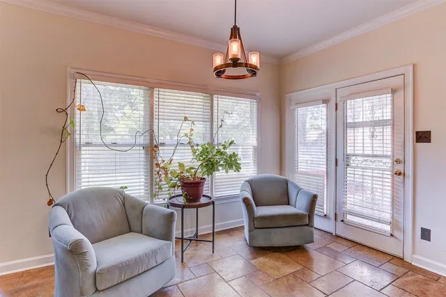 a kitchen with stainless steel appliances granite countertop a refrigerator and white cabinets