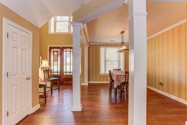 a view of a livingroom with furniture and hardwood floor