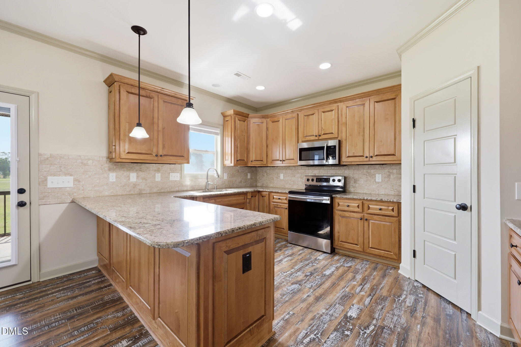 3587 Hannah Creek Road Benson, NC 27504 - Photo 14 of 43 a kitchen with stainless steel appliances granite countertop a stove a sink dishwasher a refrigerator and a microwave oven with wooden floor
