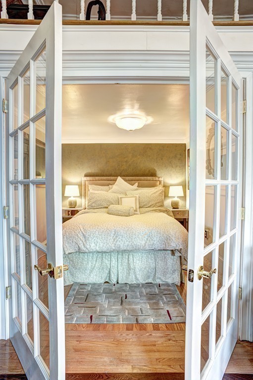 64 Commonwealth Avenue, Unit 3 Boston, MA 02116 - Photo 7 of 10 a bedroom with a bed and a window