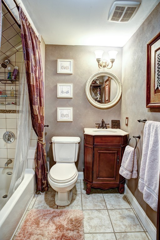 64 Commonwealth Avenue, Unit 3 Boston, MA 02116 - Photo 8 of 10 a bathroom with a toilet a sink and a mirror