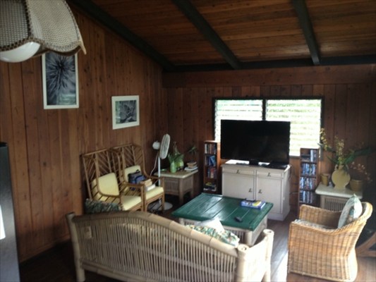 5997 Kapahi Road Kapaa, HI 96746 - Photo 6 of 8 a living room with furniture a flat screen tv and a window