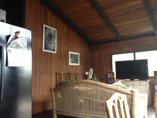 5997 Kapahi Road Kapaa, HI 96746 - Photo 7 of 8 a bedroom with a bed and a flat screen tv