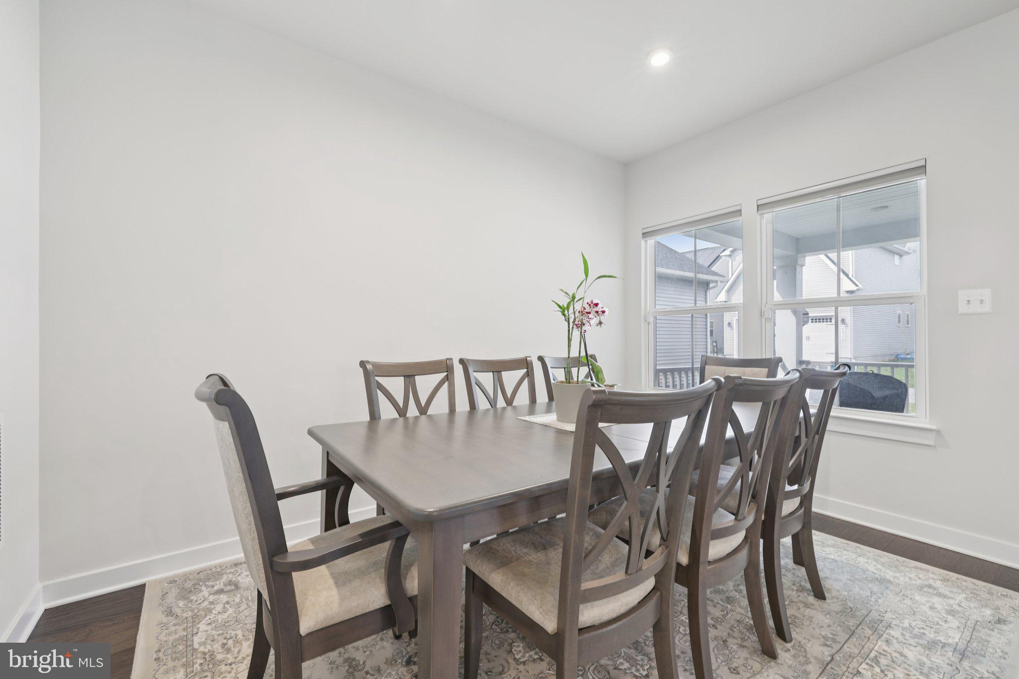 6604 River Birch Road Frederick, MD 21703 - Photo 15 of 58 a view of a dining room with furniture and window