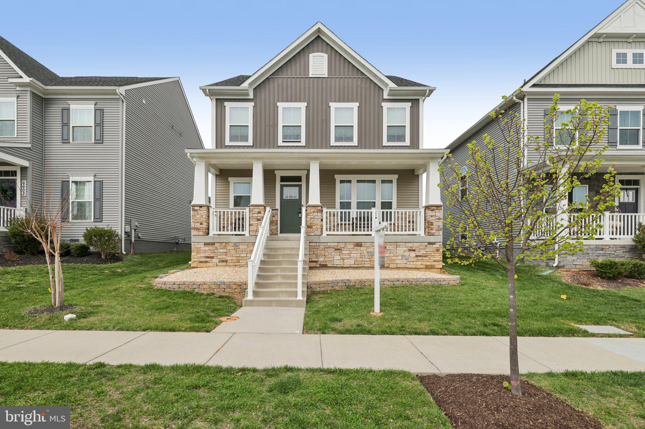 6604 River Birch Road Frederick, MD 21703 - Photo 2 of 58 a front view of a house with a yard
