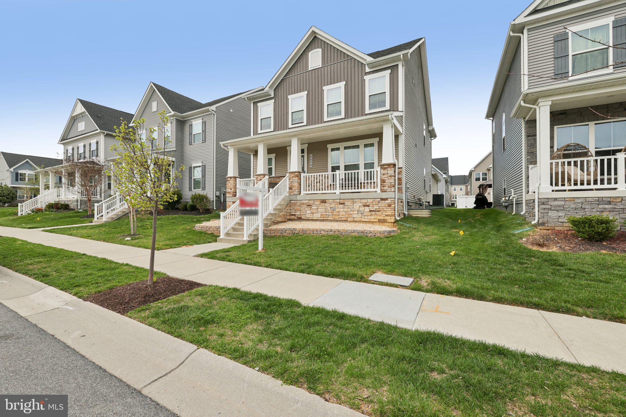 6604 River Birch Road Frederick, MD 21703 - Photo 3 of 58 a front view of a house with a yard