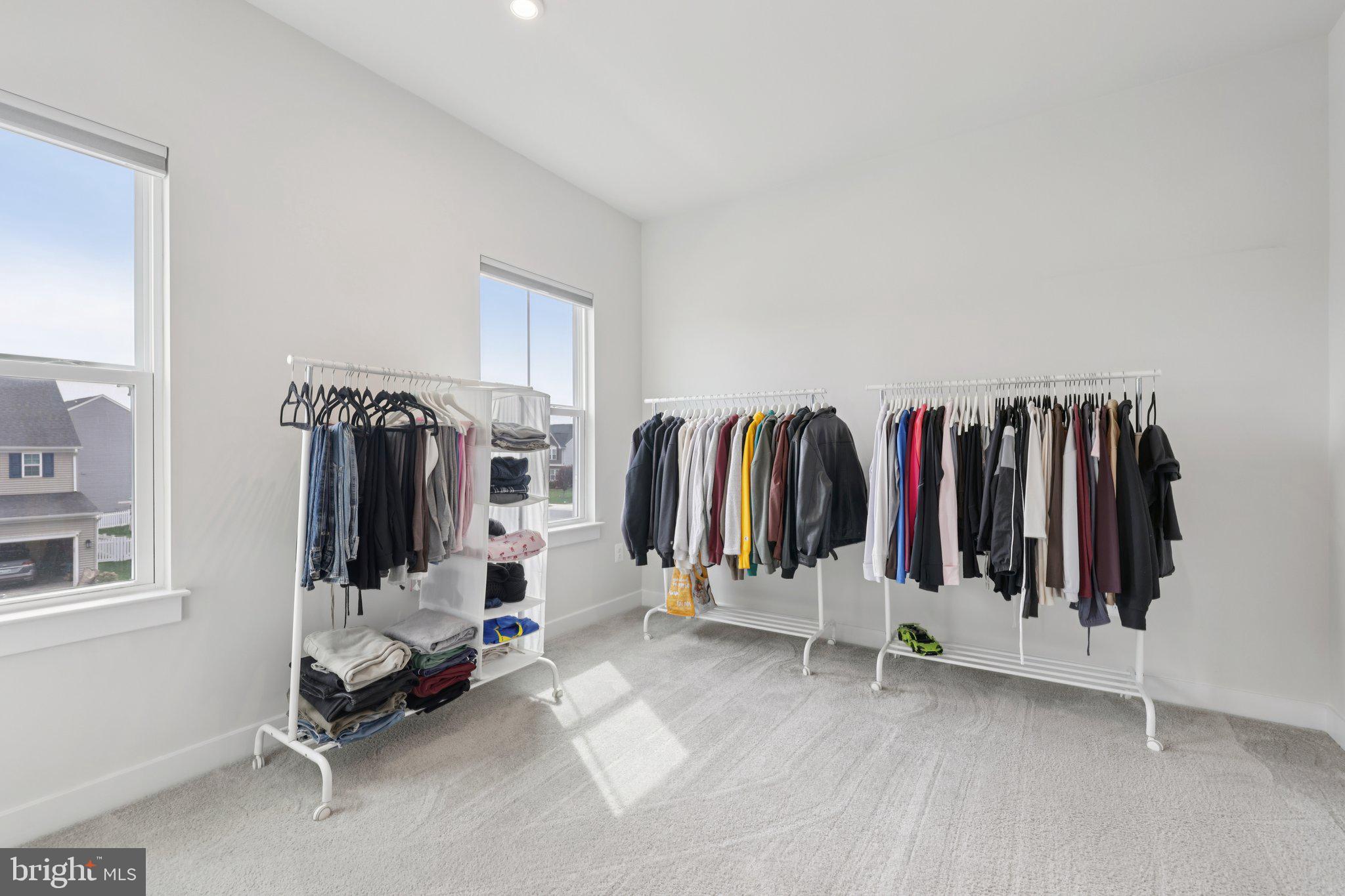 6604 River Birch Road Frederick, MD 21703 - Photo 31 of 58 a view of walk in closet with clothes