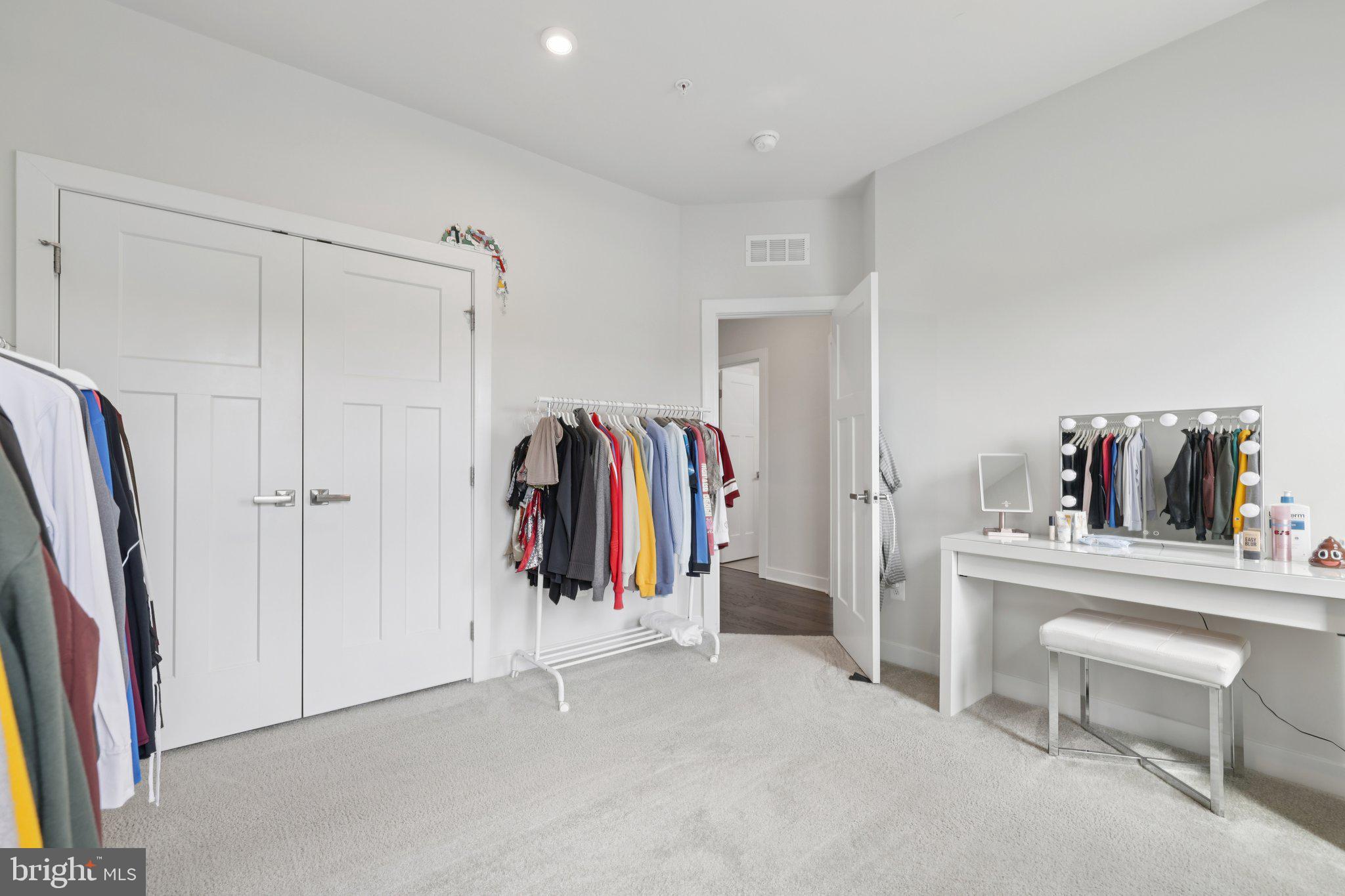 6604 River Birch Road Frederick, MD 21703 - Photo 32 of 58 a view of walk in closet with clothes and shoes