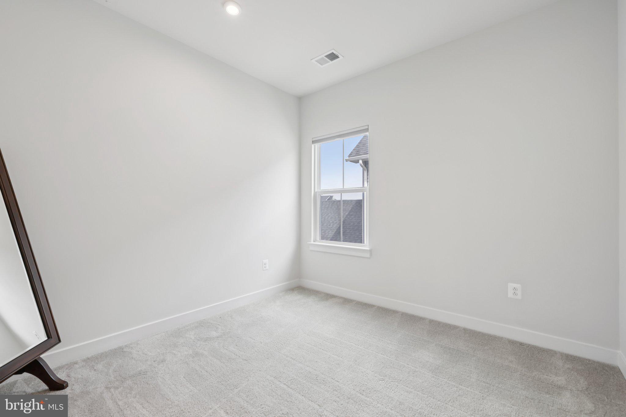 6604 River Birch Road Frederick, MD 21703 - Photo 36 of 58 a view of an empty room with a window