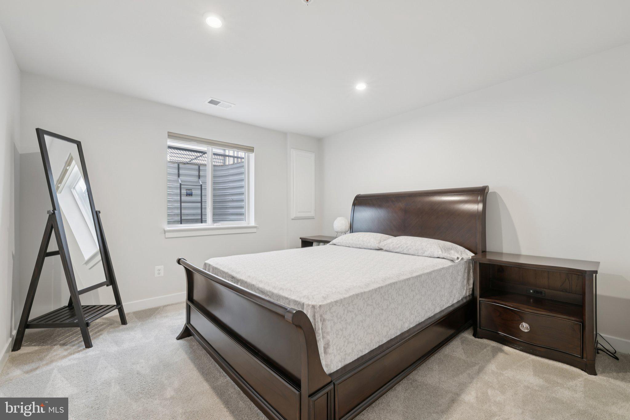 6604 River Birch Road Frederick, MD 21703 - Photo 48 of 58 a bedroom with a bed and a window
