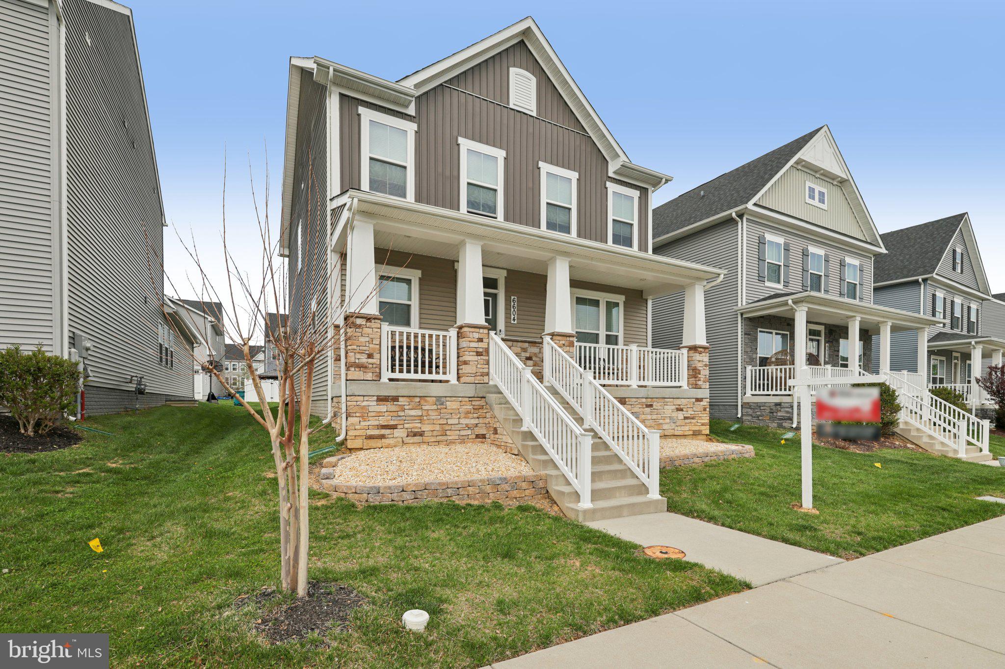 6604 River Birch Road Frederick, MD 21703 - Photo 5 of 58 a front view of a house with a yard