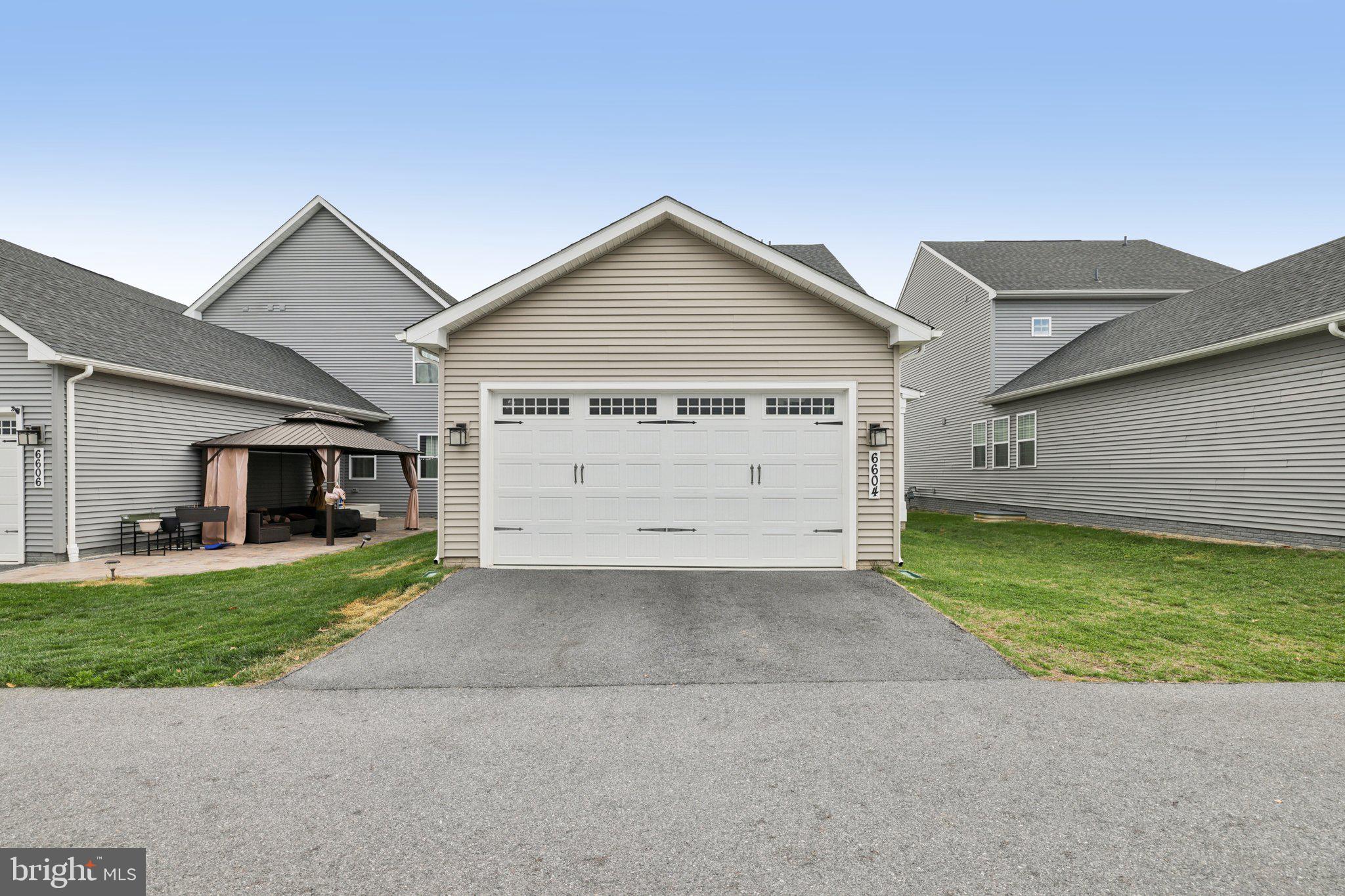 6604 River Birch Road Frederick, MD 21703 - Photo 54 of 58 a view of a house with a yard and garage
