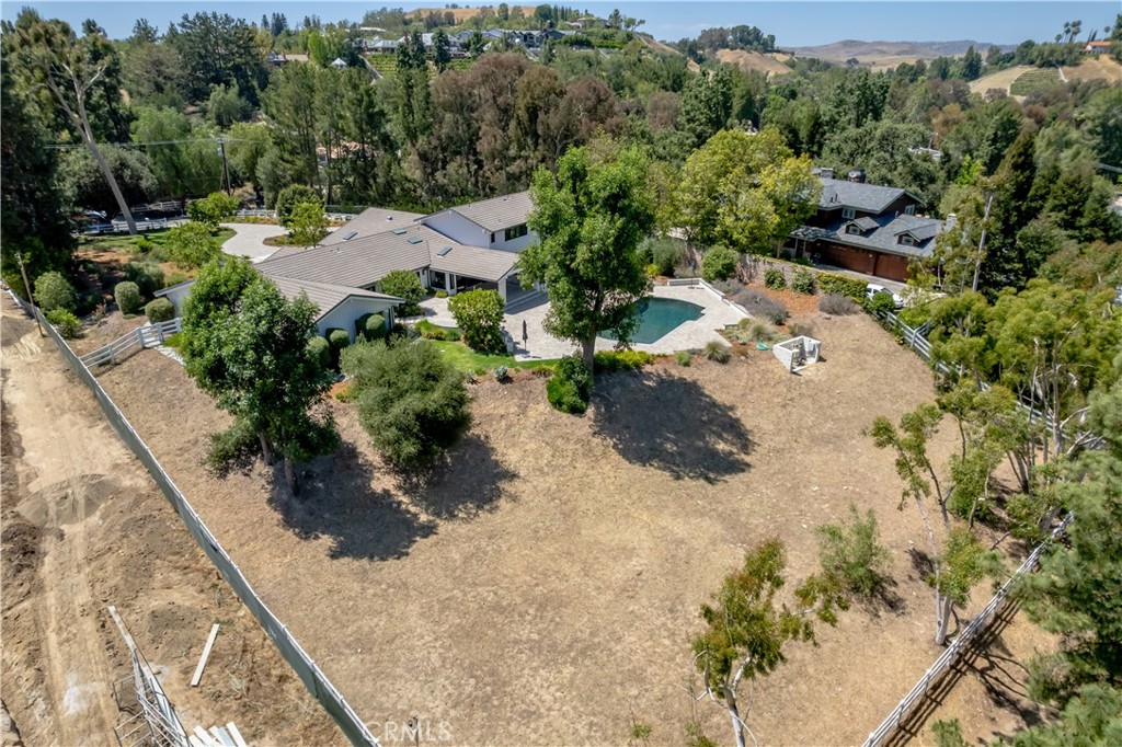 24884 Jim Bridger Road Hidden Hills, CA 91302 - Photo 30 of 31 a view of a street with a park