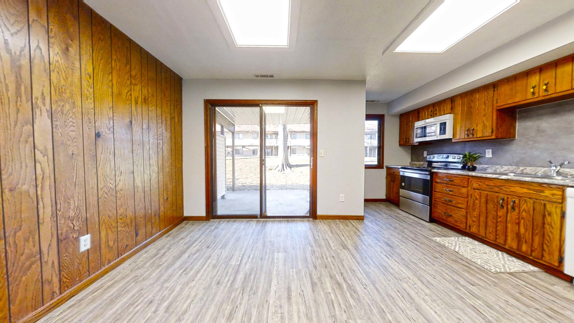 1302 Christopher Circle, Unit 4 Urbana, IL 61802 - Photo 5 of 14 a view of kitchen with wooden floor and electronic appliances