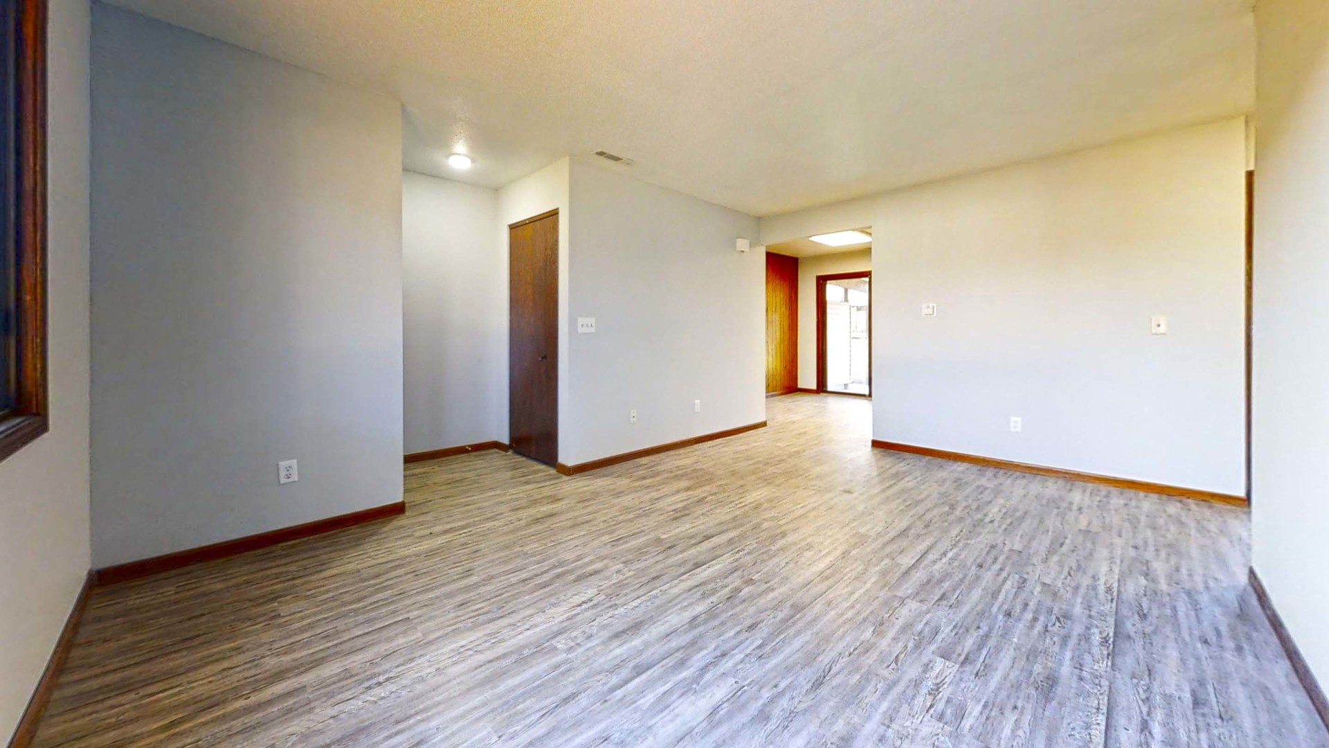 1302 Christopher Circle, Unit 4 Urbana, IL 61802 - Photo 7 of 14 a view of a room with wooden floor and window