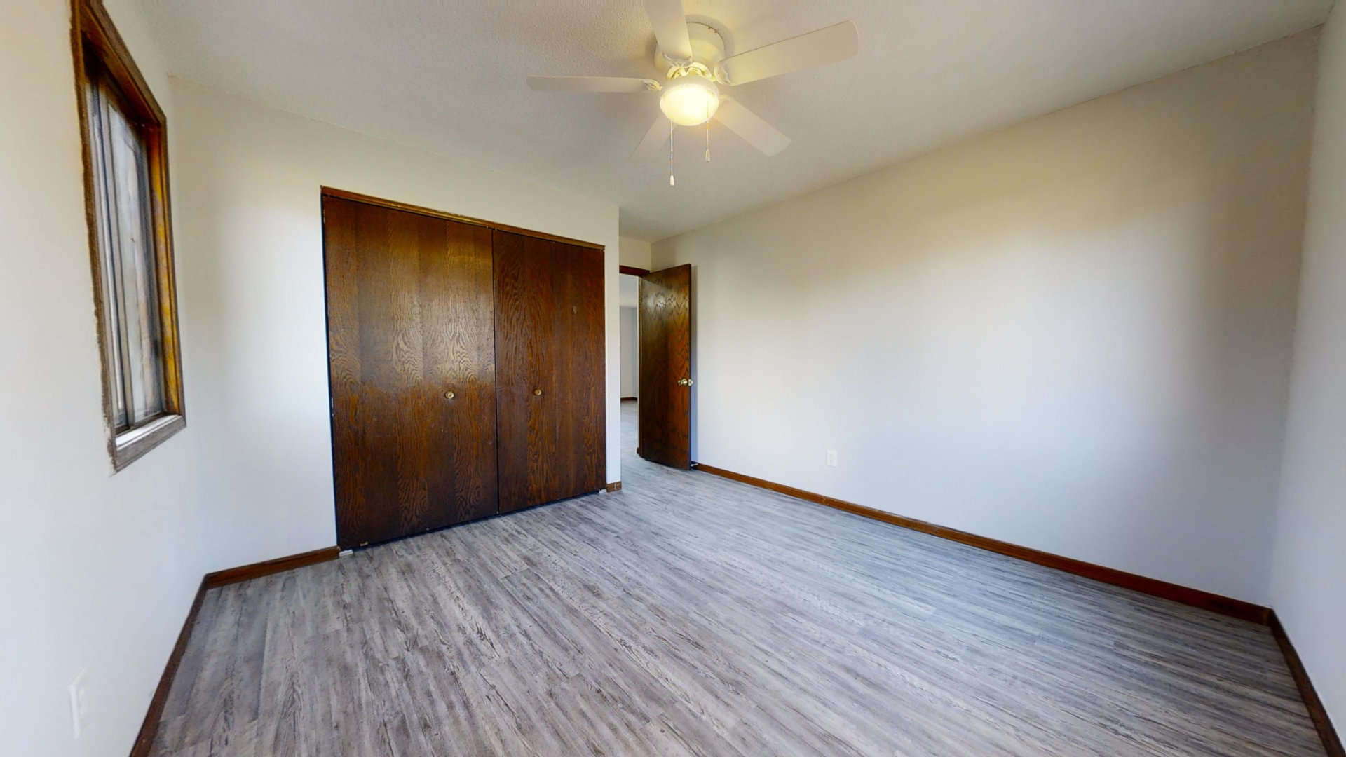 1302 Christopher Circle, Unit 4 Urbana, IL 61802 - Photo 9 of 14 a view of an empty room with wooden floor