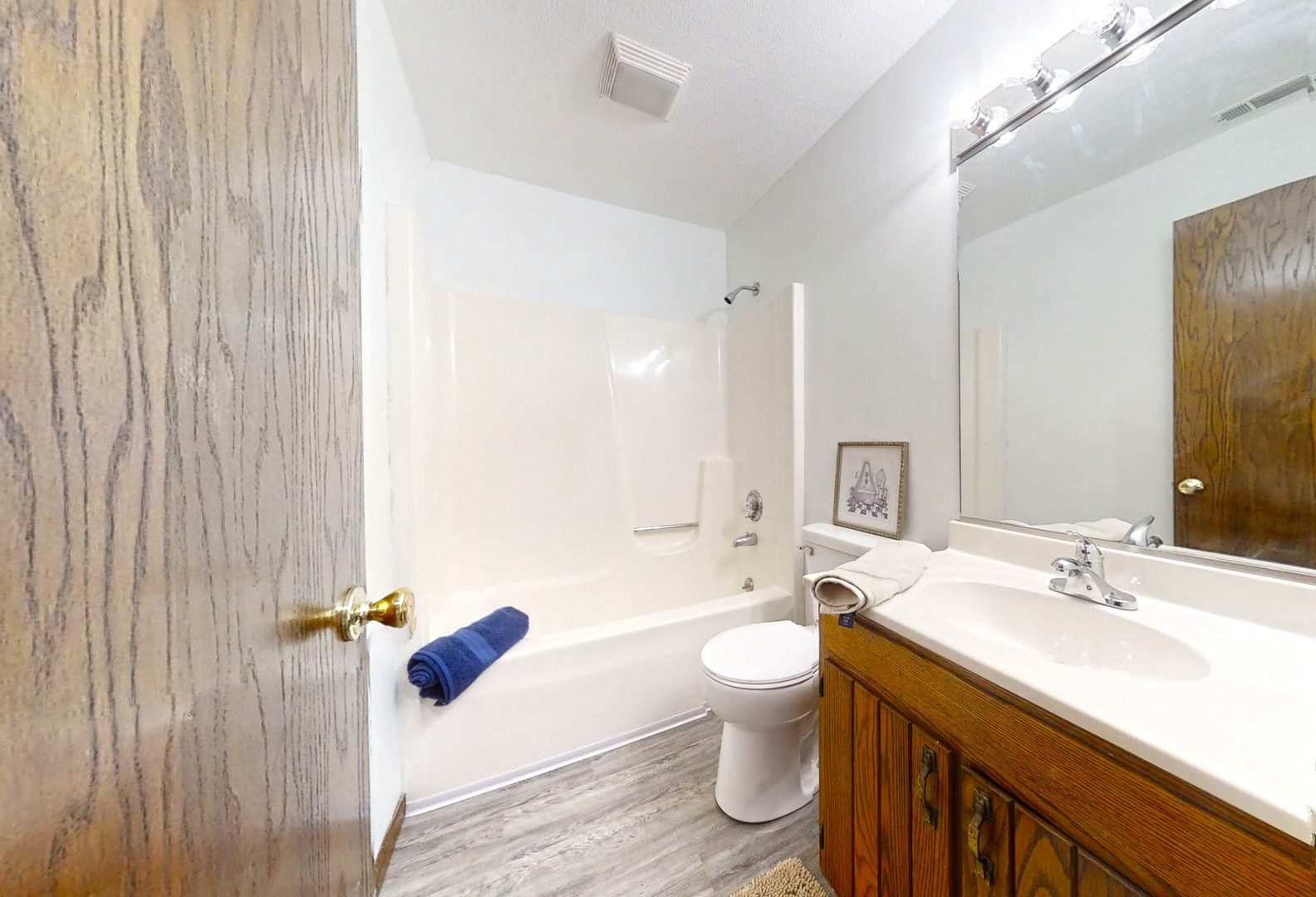 1302 Christopher Circle, Unit 4 Urbana, IL 61802 - Photo 10 of 14 a bathroom with a sink mirror toilet and bathtub