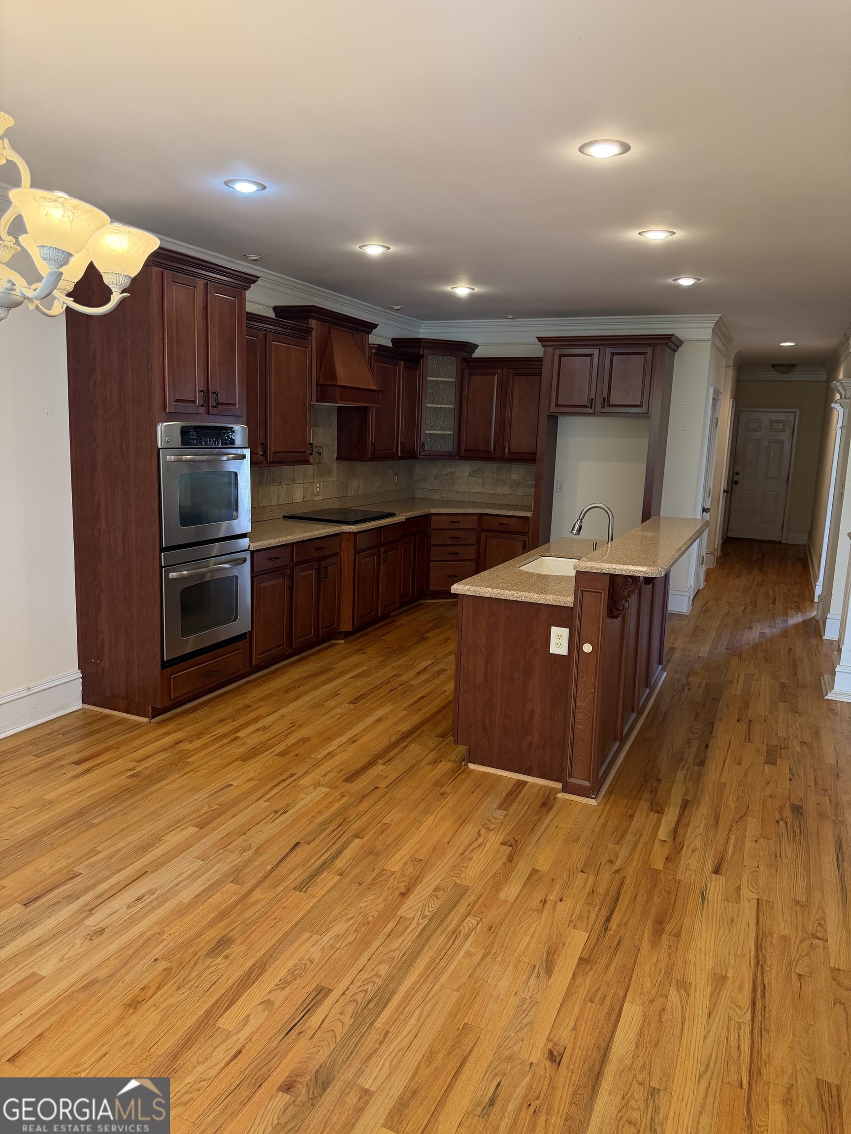 302 Norris Road Barnesville, GA 30204 - Photo 16 of 65 a kitchen with stainless steel appliances wooden cabinets and granite counter tops