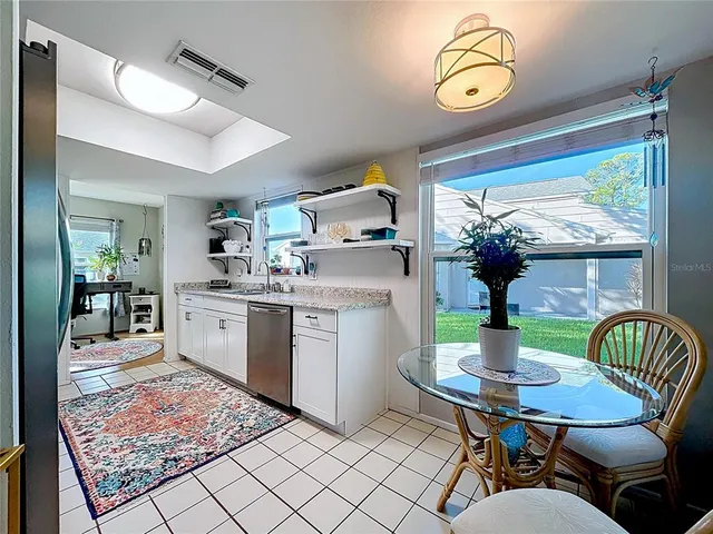 a kitchen with a table chairs and a stove