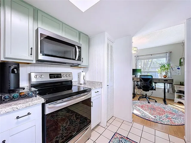 a kitchen with a stove and a microwave