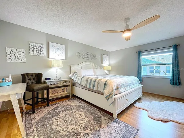 a bedroom with a bed and a desk